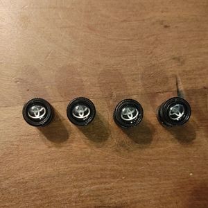 4 Black Toyota Symbol Tire Stems